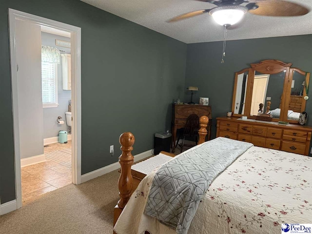 159 Ridge Rd, Cheraw, SC 29512 - bedroom with light carpet, ensuite bath, a ceiling fan, light tile patterned floors, and a textured ceiling