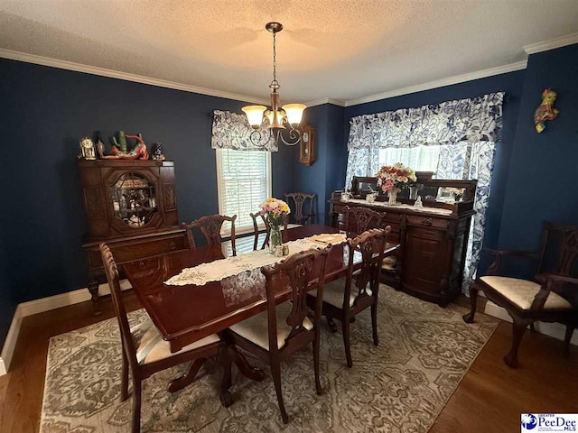 159 Ridge Rd, Cheraw, SC 29512 - dining space with a chandelier, a textured ceiling, light wood-type flooring, and crown molding
