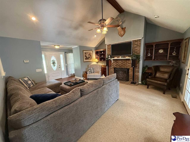 159 Ridge Rd, Cheraw, SC 29512 - living room with a ceiling fan, a brick fireplace, carpet, beam ceiling, and high vaulted ceiling