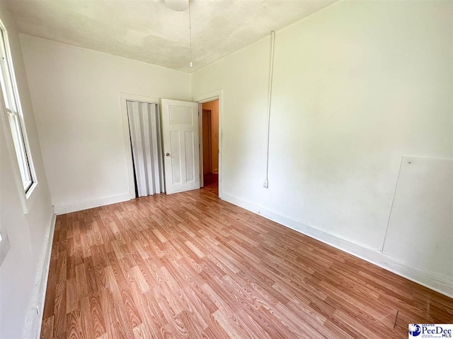 unfurnished room featuring light wood-type flooring