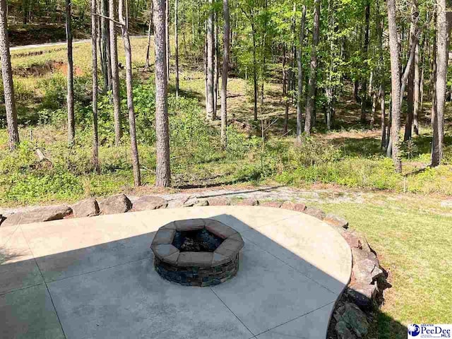 view of patio featuring a fire pit