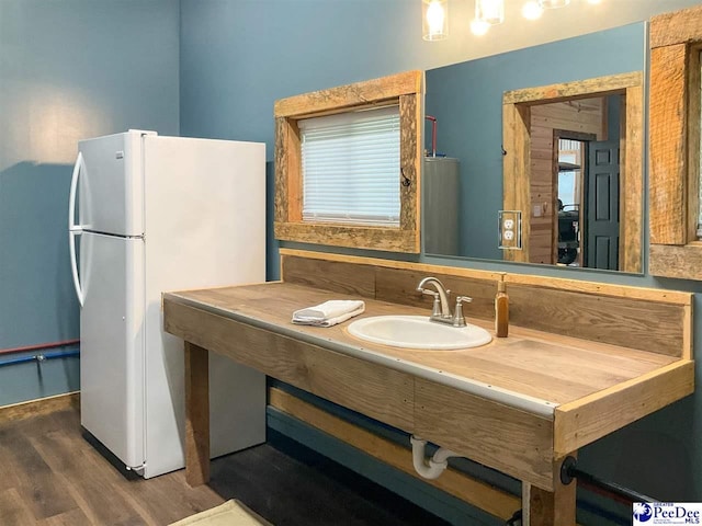 bathroom with vanity and wood finished floors