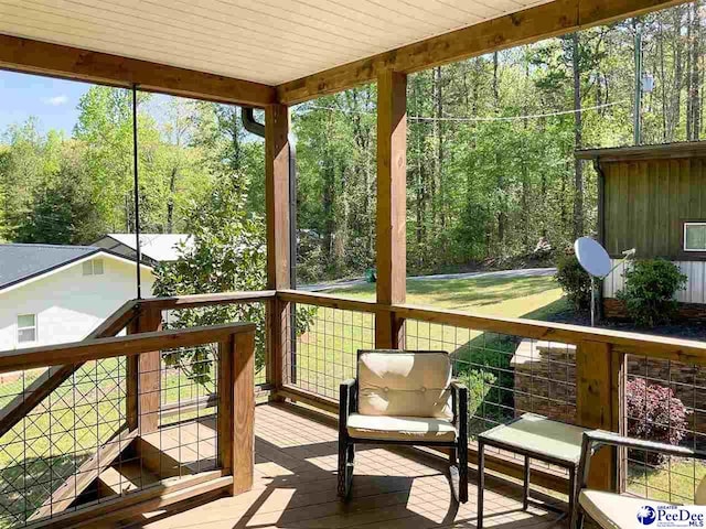 sunroom with a forest view