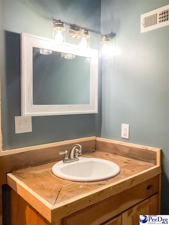 bathroom featuring visible vents and vanity