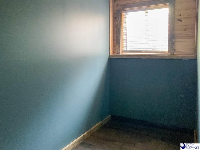 empty room featuring baseboards