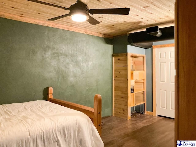 bedroom featuring wooden ceiling, ceiling fan, wood finished floors, and baseboards