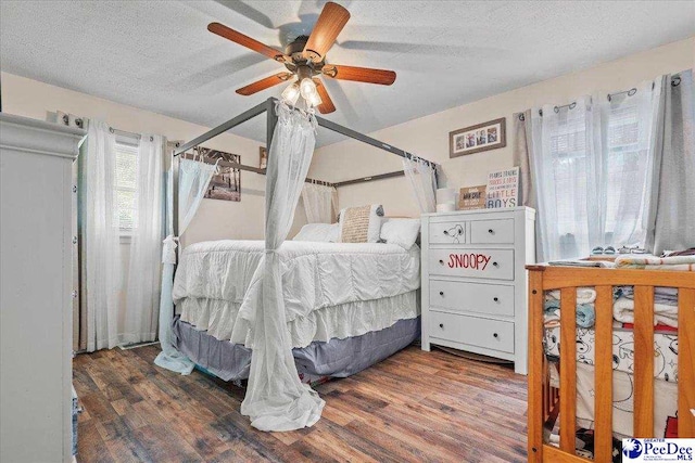 304 Wells St, Darlington, SC 29532 - bedroom with wood finished floors, a textured ceiling, and ceiling fan