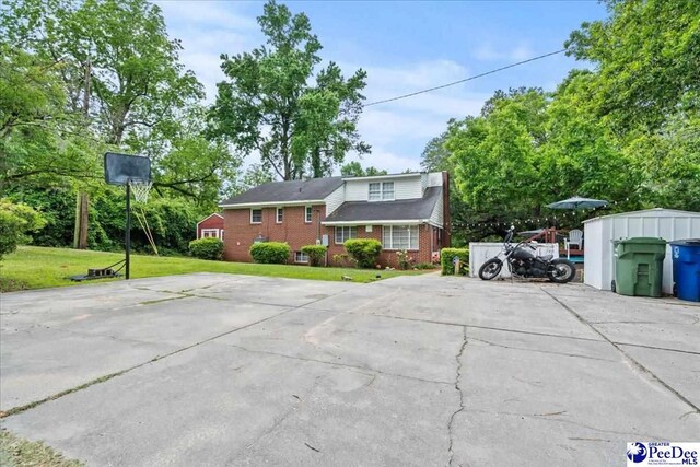 304 Wells St, Darlington, SC 29532 - view of front of home featuring brick siding and a front lawn
