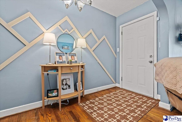304 Wells St, Darlington, SC 29532 - entrance foyer featuring wood finished floors, baseboards, and a chandelier