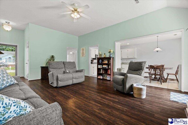 657 Red Tip Cir, Florence, SC 29501 - living room featuring a ceiling fan, wood finished floors, vaulted ceiling, and a textured ceiling