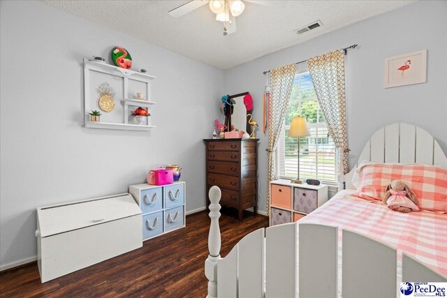 657 Red Tip Cir, Florence, SC 29501 - bedroom with wood finished floors, a textured ceiling, baseboards, and a ceiling fan