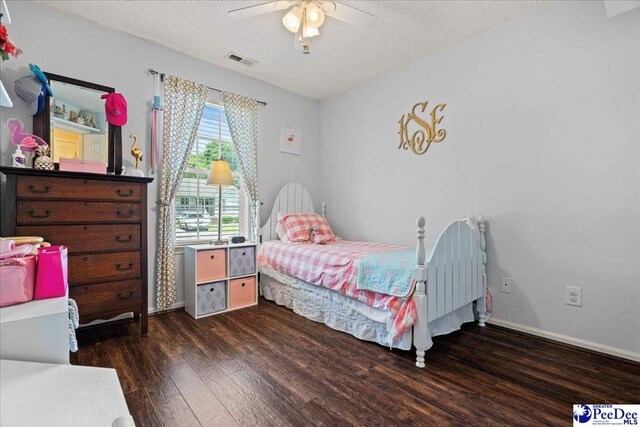 657 Red Tip Cir, Florence, SC 29501 - bedroom featuring wood finished floors, a textured ceiling, baseboards, and ceiling fan