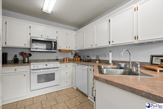657 Red Tip Cir, Florence, SC 29501 - kitchen featuring white appliances, a sink, light tile patterned floors, white cabinets, and a textured ceiling