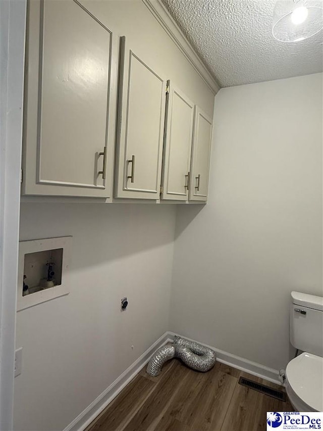 418 S Thomas Rd, Florence, SC 29501 - laundry room with dark wood-type flooring, baseboards, a textured ceiling, and washer hookup