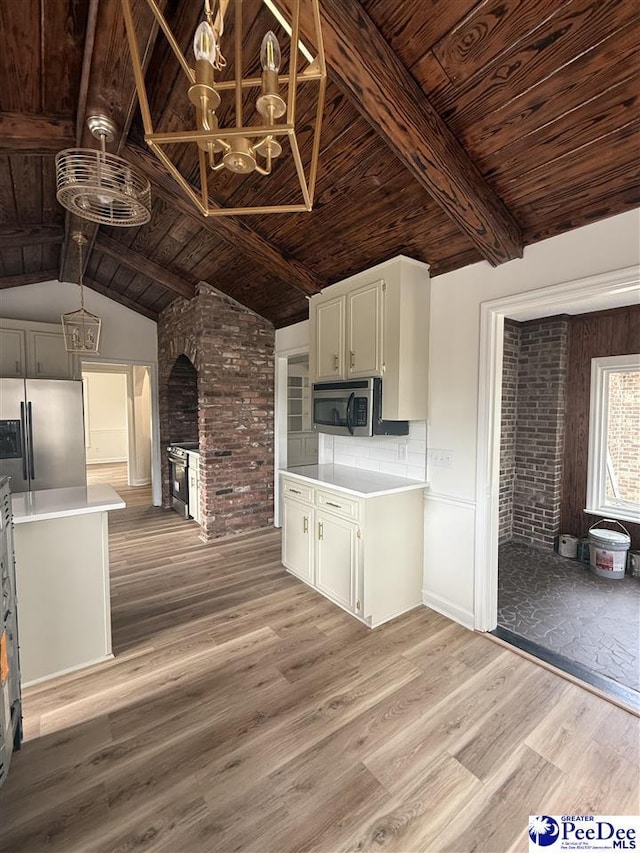 418 S Thomas Rd, Florence, SC 29501 - kitchen featuring stainless steel appliances, wood ceiling, light wood-type flooring, light countertops, and a chandelier