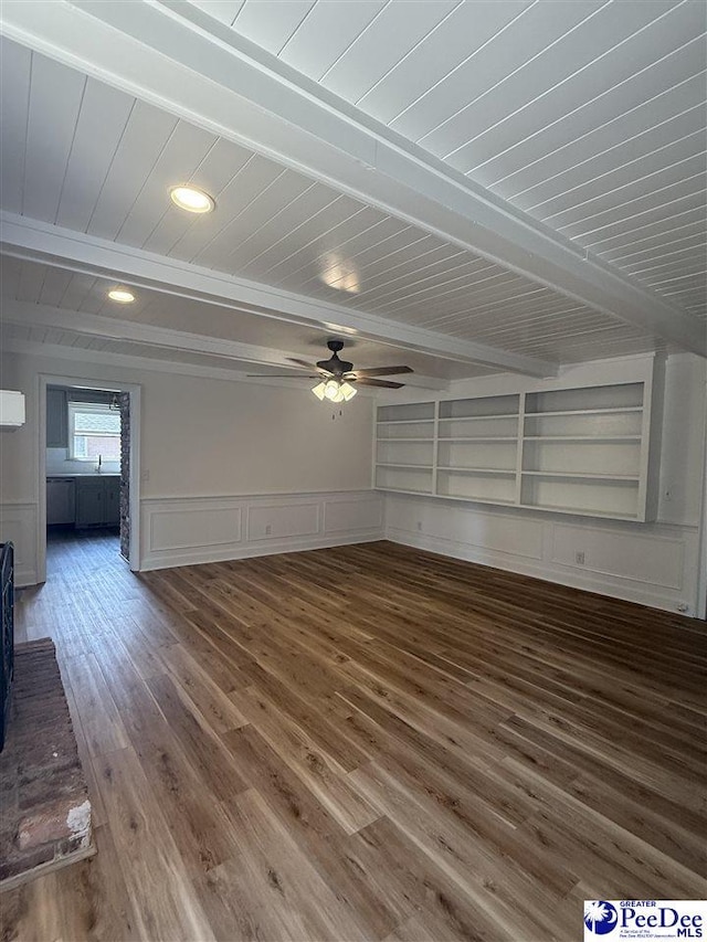418 S Thomas Rd, Florence, SC 29501 - unfurnished living room with wooden ceiling with exposed beams, wood finished floors, ceiling fan, a sink, and a decorative wall