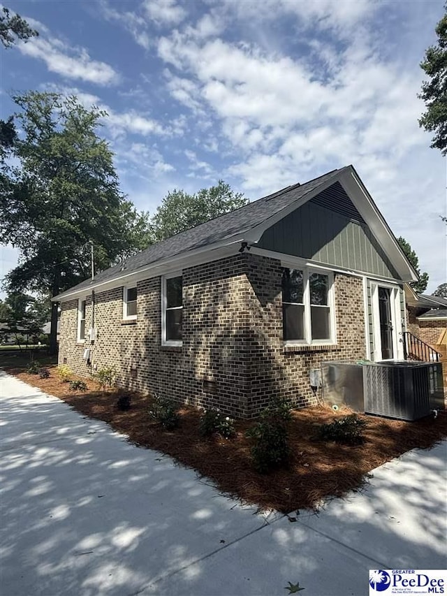 418 S Thomas Rd, Florence, SC 29501 - view of property exterior with brick siding and central air condition unit