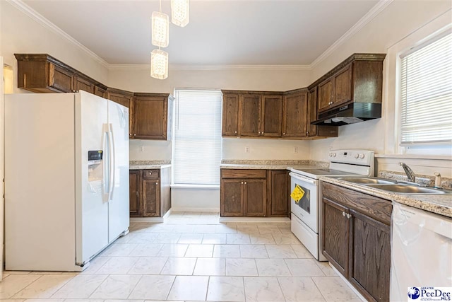 kitchen with white appliances, a sink, under cabinet range hood, pendant lighting, and crown molding