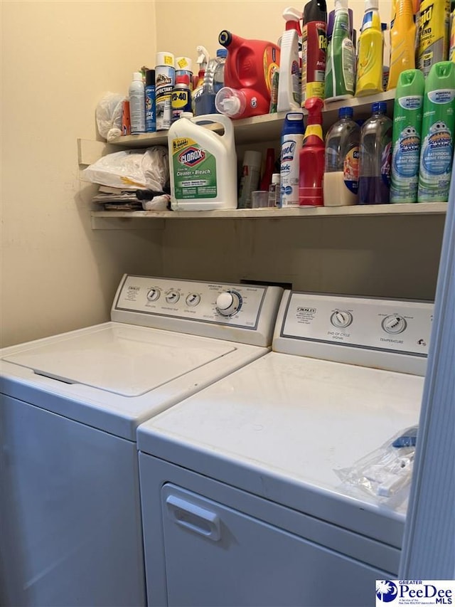 laundry room featuring washing machine and clothes dryer