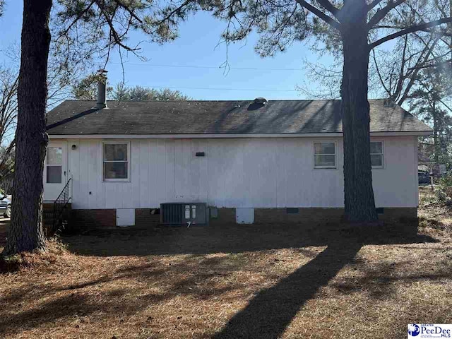 rear view of house with cooling unit