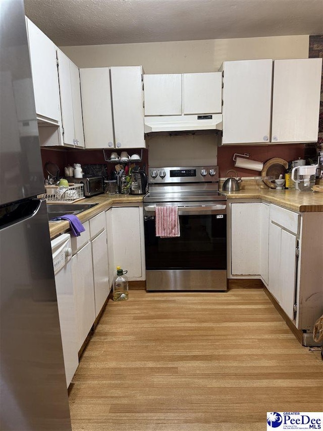 kitchen featuring a textured ceiling, light hardwood / wood-style floors, white cabinets, and appliances with stainless steel finishes