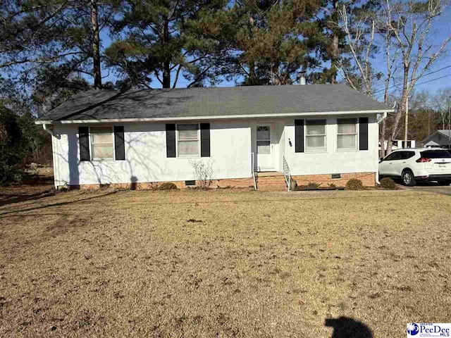 single story home featuring a front lawn