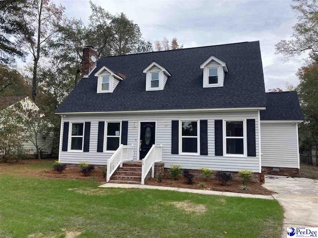 cape cod home with a front yard