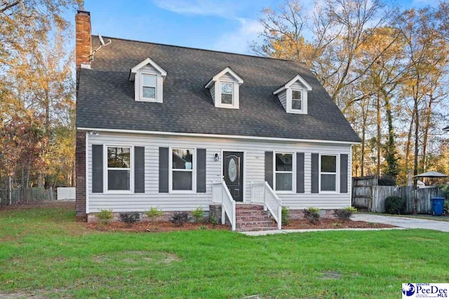 cape cod home featuring a front lawn