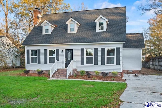 cape cod house with a front lawn