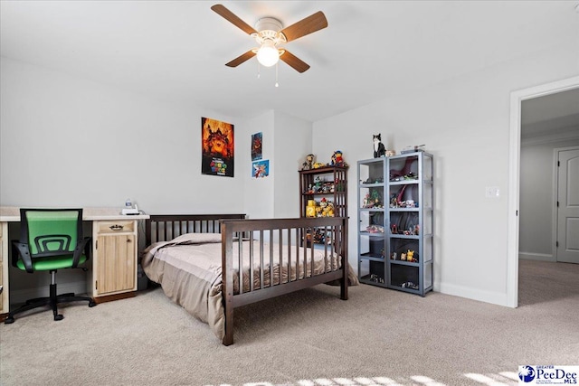 carpeted bedroom with ceiling fan