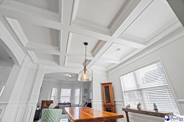 dining area with coffered ceiling, ornamental molding, plenty of natural light, and beam ceiling