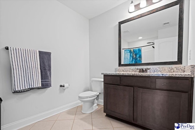 bathroom featuring a shower with curtain, vanity, toilet, and tile patterned flooring