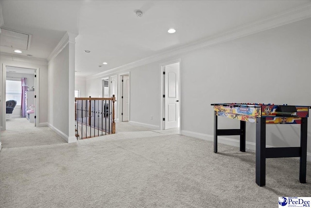 recreation room featuring ornamental molding and light colored carpet