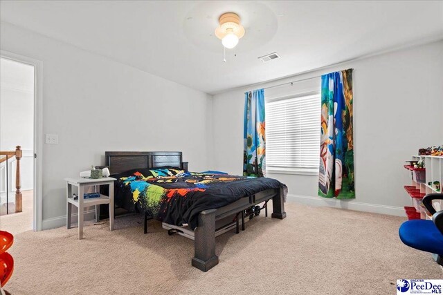 carpeted bedroom with ceiling fan