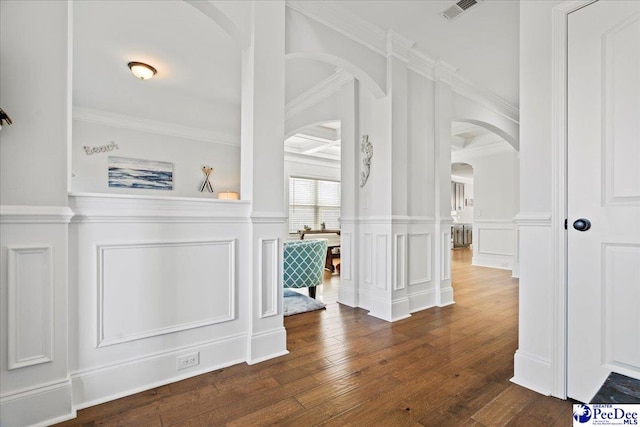 hallway with crown molding and dark hardwood / wood-style floors