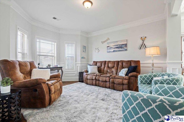 living room featuring ornamental molding and wood-type flooring