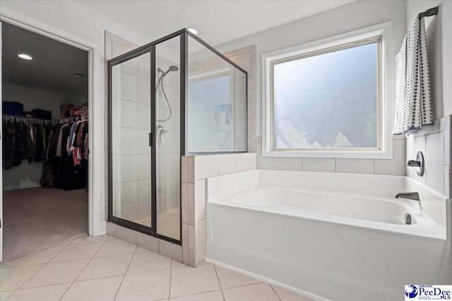 bathroom with tile patterned flooring and plus walk in shower