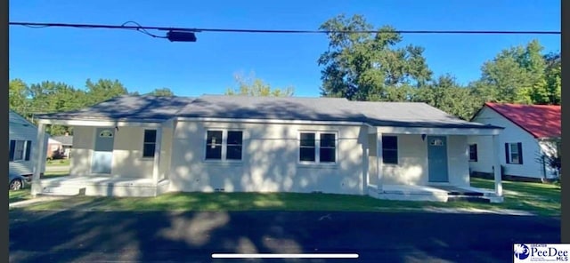 bungalow-style house featuring a patio, a front yard, and covered porch