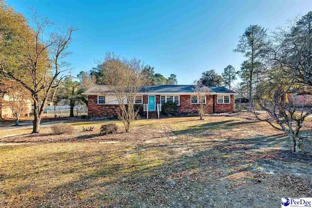 ranch-style house featuring a front lawn