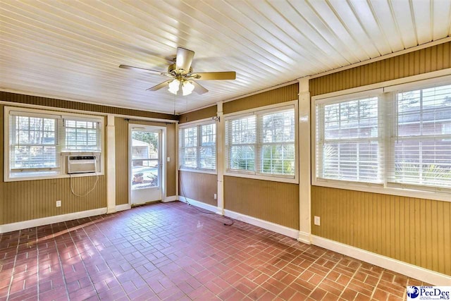 unfurnished sunroom with cooling unit and ceiling fan