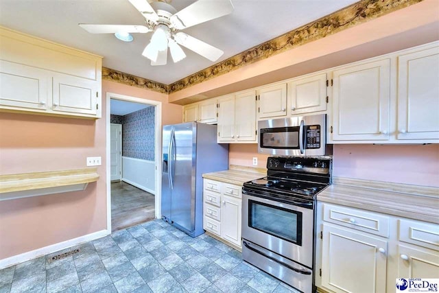 kitchen with white cabinetry, ceiling fan, and appliances with stainless steel finishes