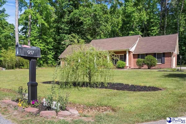 single story home featuring a front yard