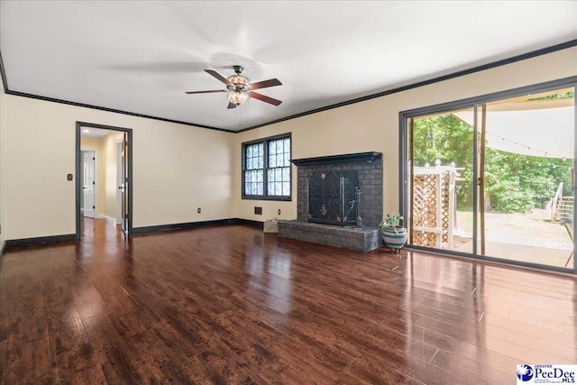 unfurnished living room featuring ceiling fan, wood finished floors, baseboards, and ornamental molding