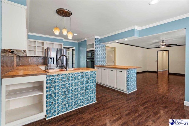 kitchen with wood counters, black appliances, open shelves, and crown molding