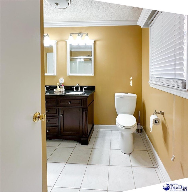 bathroom featuring crown molding, tile patterned floors, and a textured ceiling