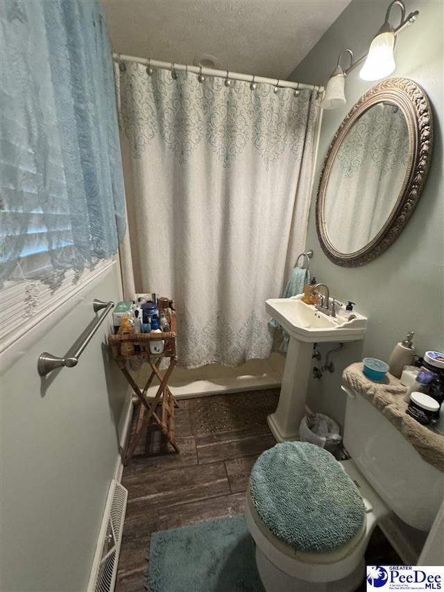 1124 N 4th Ave, Dillon, SC 29536 - bathroom featuring wood finished floors and a shower with shower curtain