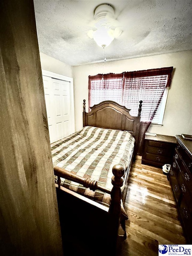 1124 N 4th Ave, Dillon, SC 29536 - bedroom with a textured ceiling, wood finished floors, and ceiling fan