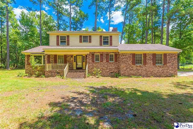 view of front of home featuring a porch and a front lawn