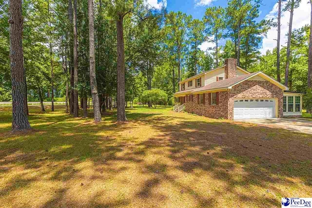 view of yard featuring a garage