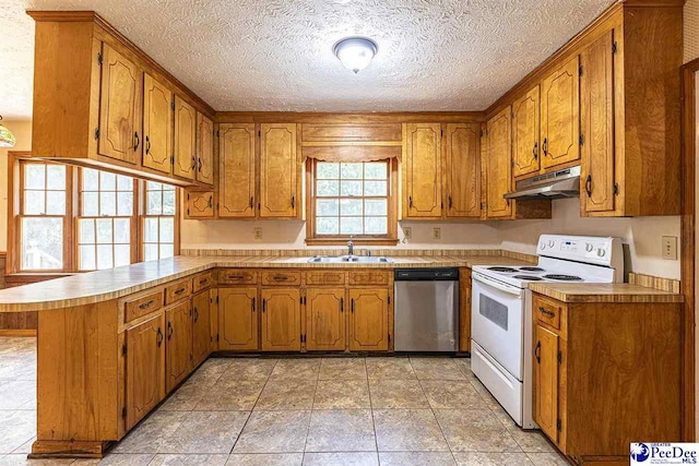 kitchen featuring electric stove, sink, a textured ceiling, stainless steel dishwasher, and kitchen peninsula